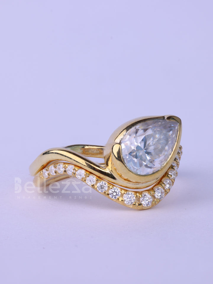 Unique Pear Cut Diamond Curved Moissanite Engagement Ring Set