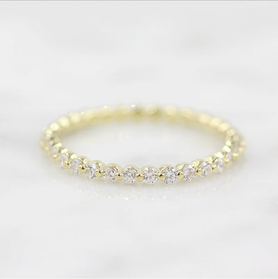 round-cut-half-eternity-moissanite-wedding-band