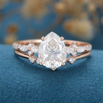 pear-shaped-moissanite-solitaire-pave-bridal-set
