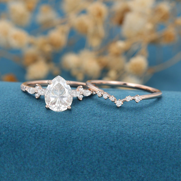 pear-shaped-moissanite-solitaire-pave-bridal-set