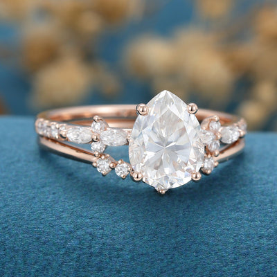 pear-shaped-moissanite-solitaire-pave-bridal-set