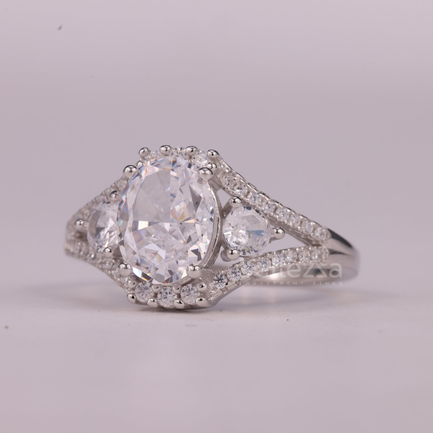 1.0CT Oval Cut Three Stone Split Shank Pave Set Engagement Ring