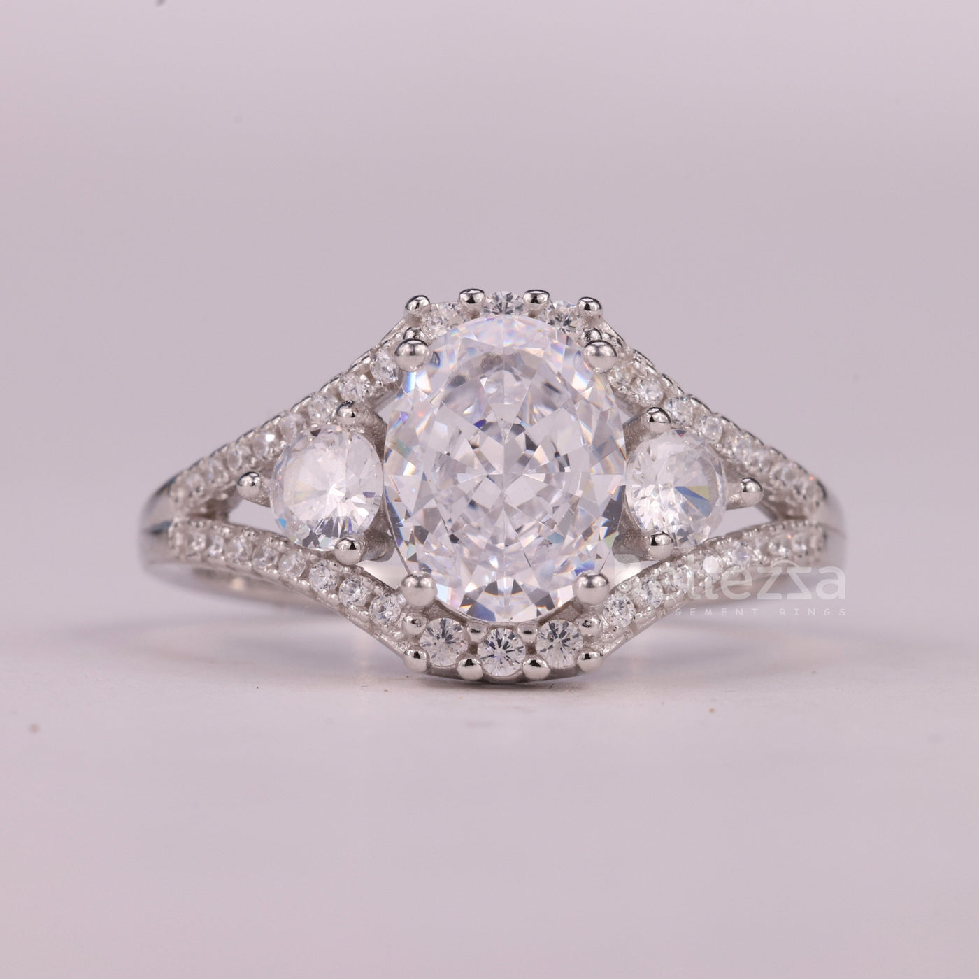 1.0CT Oval Cut Three Stone Split Shank Pave Set Engagement Ring