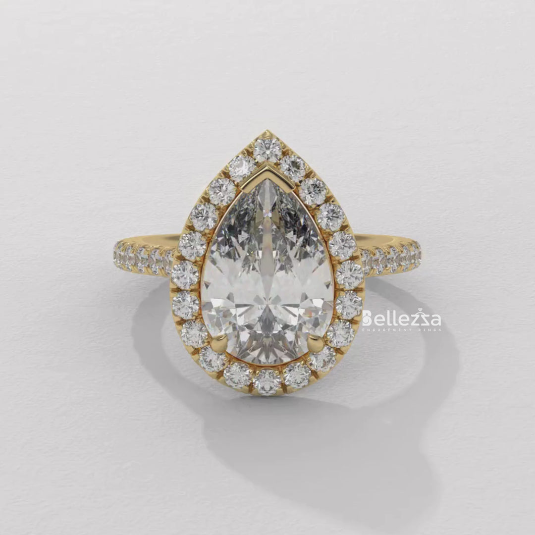 gold pear diamond ring,