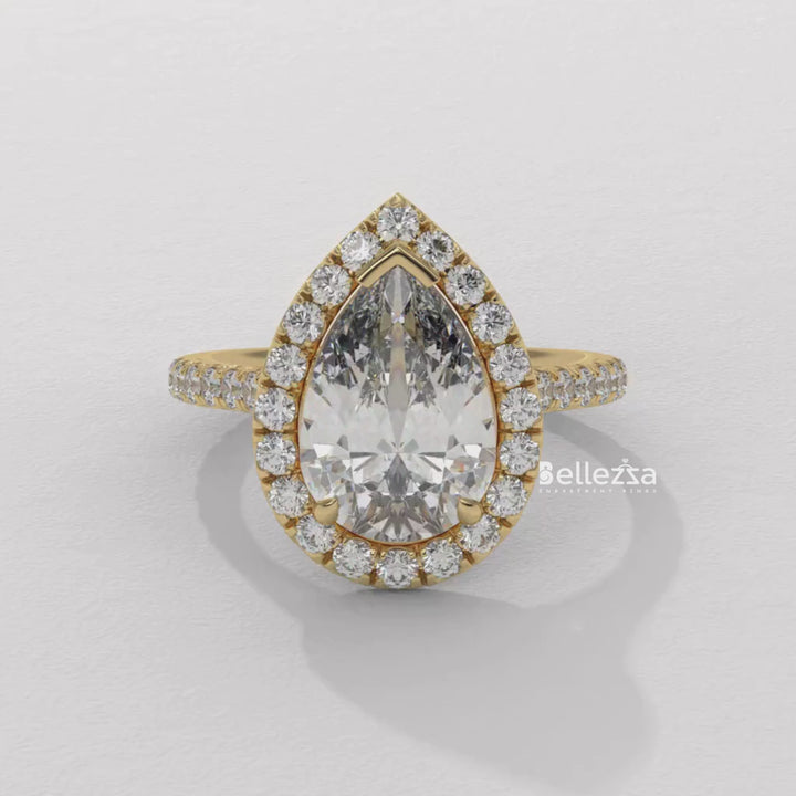 gold pear diamond ring,